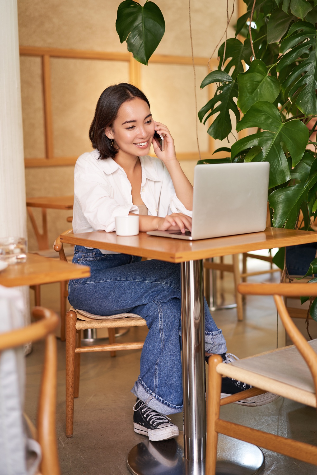 Student working with an online tutor from a laptop